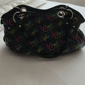 Multi color black background handbag